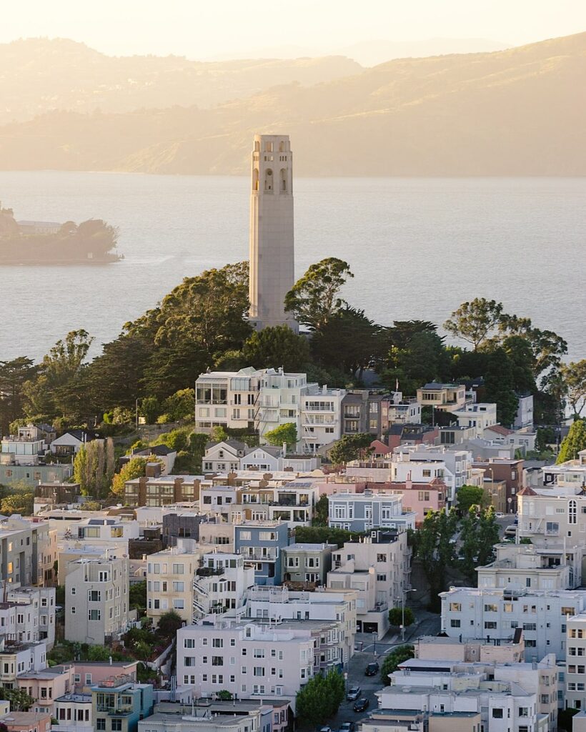 coit tower with san francisco bay in the background. wikimedia commons license photo courtesy of https://unsplash.com/photos/scGi25ps7oY